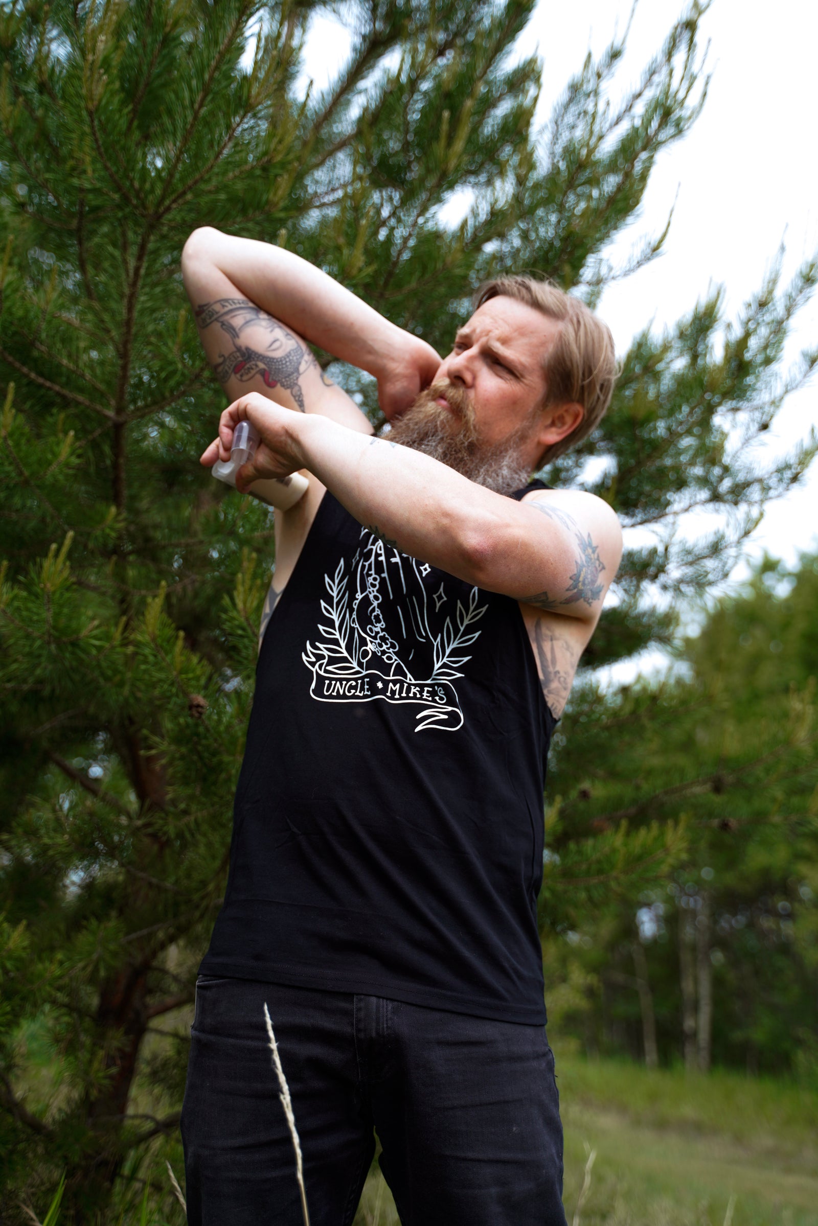 Uncle applying his best natural deodorant in the great outdoors